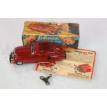 Boxed Schuco Command Car AD 2000 in dark red, tin plate in excellent condition, box showing wear