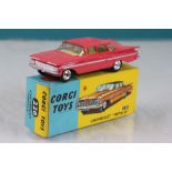 Boxed Corgi 220 Chevrolet Impala in pink diecast vg with minor paint chips, box excellent
