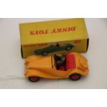 Boxed Dinky 102 MG Midget Sports in yellow with red interior and hubs, with driver, diecast gd