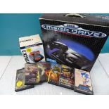 Retro Gaming - Boxed Sega Mega Drive console, a boxed Quick Shot Maverick 3 and 6 x Mega Drive games