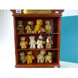 Collection of 12 Danbury Mint 'The Teddy Bear Museum Showcase' bears in collectors shelf unit with