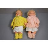 Two vintage Palitoy dolls with vintage knitted clothing, one marked "Palitoy 16G Made in England"