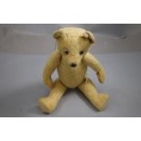 Vintage straw filled Teddy Bear with inactive growler & moving limbs and head approximately 16