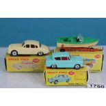 Three boxed Dinky vehicles to include 195 Jaguar 3.4 Saloon in cream with red interior, 155 Ford