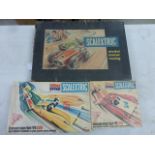 Boxed Scalextric Racing set with both slot cars, one showing damage, plus boxed Triang You Steer