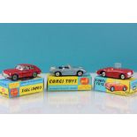 Three boxed Corgi diecast model vehicles to include 327 MGB GT in red, 318 Lotus Elan S2 in metallic