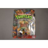 Carded Playmates Teenage Mutant Ninja Turtles General Traag figure, unpunched, card with some