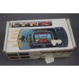 Boxed Atari Lynx hand held console with 3 x games to include Chips Challenge, Gates of Zendocon