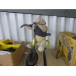 Vintage tricycle with added soft toy teddy bear to seat