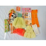 1968 Taiwan made Barbie doll with a small selection of clothing & booklets