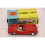 Boxed Corgi 302 MGA Sports Car in red with driver, windscreen vg, diecast vg with some paint