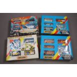 Four boxed Matchbox Action Packs / sets to include G6 Virgin G3 JCB World Beaters in Action, G10