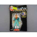 Original carded LJN Thundercats Tygra figure with some bend to the card and crease to the top,