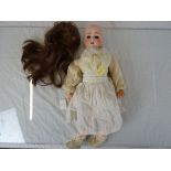 Early 20th century Alt Beck and Gottschalck Bisque Headed Doll with sleeping brown eyes and open