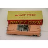 Boxed Dinky 131 Roadster Cadillac in salmon pink, with driver, diecast vg with a few paint chips,