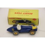 Boxed Dinky 234 Ferrari Racing Car in blue with white driver, yellow hubs and front, race number