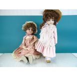 Two vintage Bisque headed Dolls with clothing, one marked "Bru My Precious 1982" the other "Schoenau