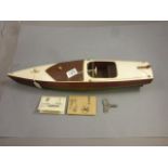 Kellner clockwork Speed boat with wooden hull, approx 23" in length, with key