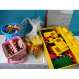 Pink Lego storage pot of Lego bricks, vintage box of Dublo and a plastic bin of stickle bricks