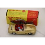 Boxed Dinky 114 Triumph Spitfire in gold with driver and red interior, vg with a few marks, box gd/