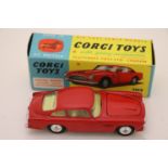 Boxed Corgi 218 Aston Martin DB4 in red with yellow interior, diecast excellent, box vg