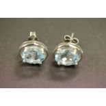 A pair of silver and aquamarine earrings