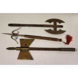 Four reproduction bladed weapons with turned handles.