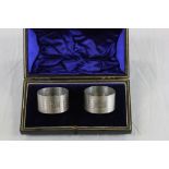 Pair of cased silver hallmarked napkin rings, Maker Crisford & Norris Birmingham on a L.