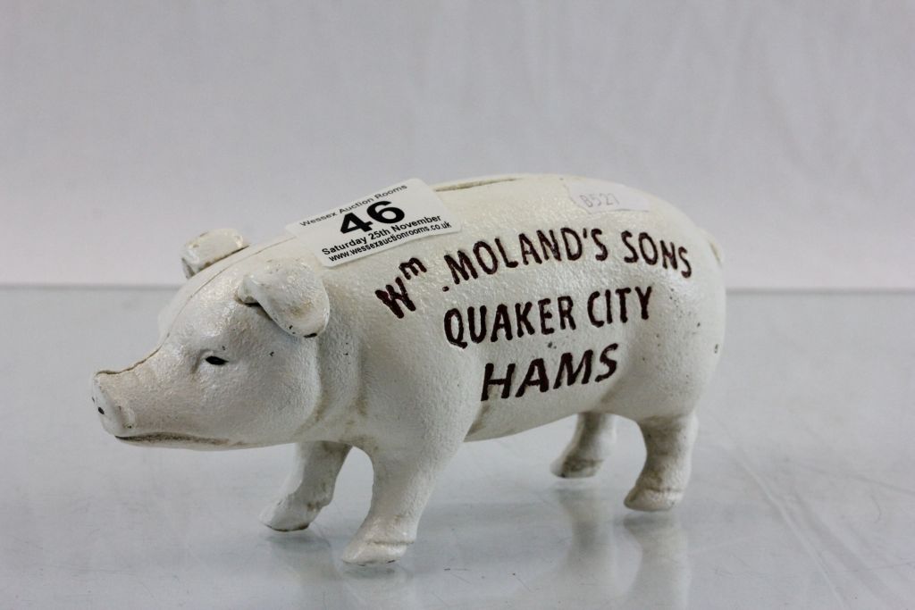 A novelty cast iron pig moneybox