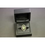 A 9ct yellow gold Art Deco style peridot and diamond ring