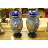 Pair of Royal Doulton art pottery vases with floral decoration Artist mark MB Maud Bowden.