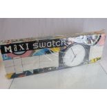 Maxi Swatch display watch and original box. Opened once by owner to test working order