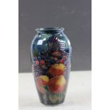 Moorcroft vase depicting Birds pecking Fruit