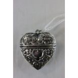 A silver heart shaped pendant necklace