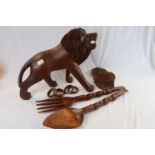 Large Hardwood Carved Lion together with a Pair of African Wooden Carved Oversized Salad Servers,