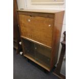 Heal's of London 1950's Teak Cocktail Cabinet above Two Glass Sliding Doors raised on Dark Stained