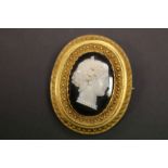 Victorian Mourning brooch in yellow metal with glass cameo centre