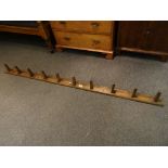 Pine set of ten coat pegs formally from a stable yard