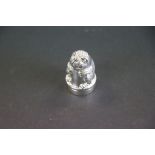 A silver thimble and pincushion in the form of a rabbit