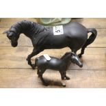 A Beswick Black Beauty horse figure and foal.