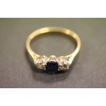 18ct Gold engagement ring set with Diamonds & a central Sapphire