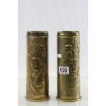 A pair of trench art decorated shell vases dated 1918.