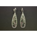 A pair of silver marcasite and ruby earrings