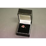 Ladies 9ct gold ring set with pink stone in a heart shaped mount