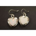 A pair of silver and opal heart shaped earrings