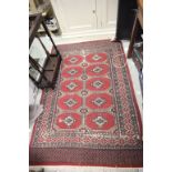 Eastern Red Ground Wool Rug with Geometric Pattern
