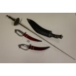 Pair of curved daggers with horse head pummels ,a kukri knife and foil.