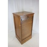 Early 20th century French Oak Stationery Cabinet, the lockable tambour front revealing four