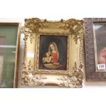 Oil on Panel of Madonna and Child contained in an ornate gilt frame
