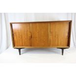 Heal's of London 1950's Teak Sideboard with Three Sliding Doors and Interior Drawer raised on Dark